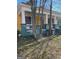 Side view of the house with a porch and mature trees at 1786 Lakewood Se Ave, Atlanta, GA 30315