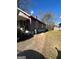 Side yard view of house with additional driveway space at 1839 Lakewood Se Ave, Atlanta, GA 30315