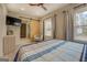 Main bedroom with sliding barn door to ensuite bathroom at 480 Mitchell Rd, Covington, GA 30014