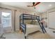 Bedroom with bunk beds, ceiling fan, and ample natural light at 480 Mitchell Rd, Covington, GA 30014