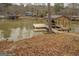 Covered boat dock with lift and plenty of space for lake access at 480 Mitchell Rd, Covington, GA 30014