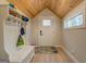 Bright entryway with built-in bench and wood ceiling at 480 Mitchell Rd, Covington, GA 30014
