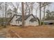 Lake house showcasing modern design and garage at 480 Mitchell Rd, Covington, GA 30014