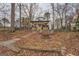 Modern lake house with a fire pit and steps to the lake at 480 Mitchell Rd, Covington, GA 30014
