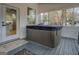 Enjoy a relaxing hot tub on the screened porch at 480 Mitchell Rd, Covington, GA 30014
