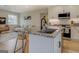 Kitchen island with granite top, sink, and stainless steel dishwasher at 480 Mitchell Rd, Covington, GA 30014