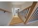 Wooden staircase with black metal railing at 480 Mitchell Rd, Covington, GA 30014
