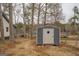 Gray metal storage shed with lake view at 480 Mitchell Rd, Covington, GA 30014