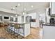 Modern kitchen with large island, stainless steel appliances & hardwood floors at 803 Natchez Ct, Peachtree City, GA 30269