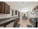 Eat-in kitchen with dark cabinetry and stainless steel appliances at 4197 Arnolds Mill Opas, Douglasville, GA 30135