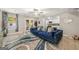 Living room with blue couch, glass coffee table, and access to backyard at 4197 Arnolds Mill Opas, Douglasville, GA 30135
