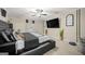 Main bedroom with large bed, TV, and decorative plants at 4197 Arnolds Mill Opas, Douglasville, GA 30135
