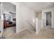 Upstairs hallway with carpet and access to bedrooms at 2631 Lovejoy Crossing Dr, Hampton, GA 30228