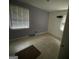 Bright bedroom with tile floors and window blinds at 4443 Flat Shoals Pkwy, Decatur, GA 30034