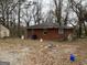 Brick house with a yard and detached building at 4443 Flat Shoals Pkwy, Decatur, GA 30034