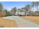 Long driveway leading to a two-story house with attached garage at 160 Beverly Farms Dr, Sharpsburg, GA 30277