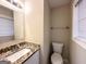 Clean bathroom with granite countertop, sink, and toilet at 2749 Williamsburg Dr, Decatur, GA 30034