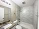 Updated bathroom with granite vanity and marble tile shower/tub surround at 2749 Williamsburg Dr, Decatur, GA 30034