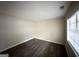 Spacious bedroom with dark laminate wood flooring and window blinds at 2749 Williamsburg Dr, Decatur, GA 30034
