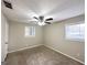 Spacious bedroom with ceiling fan and neutral colored carpet at 2749 Williamsburg Dr, Decatur, GA 30034