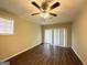 Bedroom with ceiling fan, sliding glass doors, and laminate flooring at 2749 Williamsburg Dr, Decatur, GA 30034