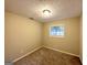 Well-lit bedroom with neutral walls and carpeted flooring at 2749 Williamsburg Dr, Decatur, GA 30034