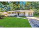 Ranch style home with carport and well-manicured lawn at 2749 Williamsburg Dr, Decatur, GA 30034