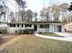 Brick ranch home with a covered porch and mature trees at 2749 Williamsburg Dr, Decatur, GA 30034