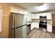 Modern kitchen with white cabinets, stainless steel appliances, and granite countertops at 2749 Williamsburg Dr, Decatur, GA 30034