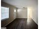 Bright living room featuring dark laminate flooring and neutral walls at 2749 Williamsburg Dr, Decatur, GA 30034