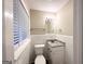 Small bathroom with white tile and granite countertop at 3029 Mckenzie Rd, East Point, GA 30344