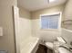 Clean bathroom with white tile and granite vanity top at 3029 Mckenzie Rd, East Point, GA 30344