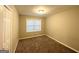 Simple bedroom with neutral carpeting and a closet at 3029 Mckenzie Rd, East Point, GA 30344
