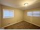 Cozy bedroom with neutral carpeting and ample natural light at 3029 Mckenzie Rd, East Point, GA 30344