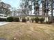 House exterior showcasing a well-maintained lawn and landscaping at 3029 Mckenzie Rd, East Point, GA 30344