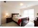 Bedroom featuring a double bed, wooden furniture, and window at 75 Dunning Keep, Covington, GA 30016