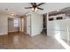 Living room with tile floors, stairs, and kitchen view at 9200 Sunset Dr, Jonesboro, GA 30238