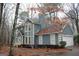 Two-story house with gray siding, attached garage, and landscaping at 732 Country Lake Drive Dr, Hampton, GA 30228