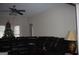 Living room with sectional sofa, Christmas tree, and ceiling fan at 732 Country Lake Drive Dr, Hampton, GA 30228