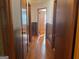 Hallway with wood paneling and hardwood floors at 6099 Winview Dr, Forest Park, GA 30297