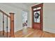 Elegant entryway with hardwood floors and front door at 200 Marthas Cv, Fayetteville, GA 30215