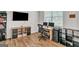 Home office with hardwood floors, large window, and built-in shelving at 4929 Calgary Dr, Douglasville, GA 30135