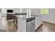 Kitchen island with granite countertop and stainless steel dishwasher at 4929 Calgary Dr, Douglasville, GA 30135