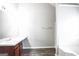 Bathroom with double vanity, large mirror, and tub shower combo at 4626 Derby Loop, Fairburn, GA 30213