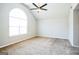 Bright bedroom featuring an arched window and ceiling fan at 4626 Derby Loop, Fairburn, GA 30213