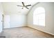 Spacious bedroom with an arched window and ceiling fan at 4626 Derby Loop, Fairburn, GA 30213