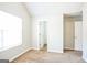Well-lit bedroom with neutral walls, carpet flooring, and a window providing natural light at 4626 Derby Loop, Fairburn, GA 30213