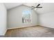 Spacious bedroom with large arched window, ceiling fan, and neutral carpeting at 4626 Derby Loop, Fairburn, GA 30213