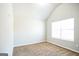 Spacious bedroom with neutral walls and carpet and a large window that provides plenty of natural light at 4626 Derby Loop, Fairburn, GA 30213