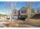 Two-story house with a brick and siding exterior, attached garage, and landscaping at 4626 Derby Loop, Fairburn, GA 30213